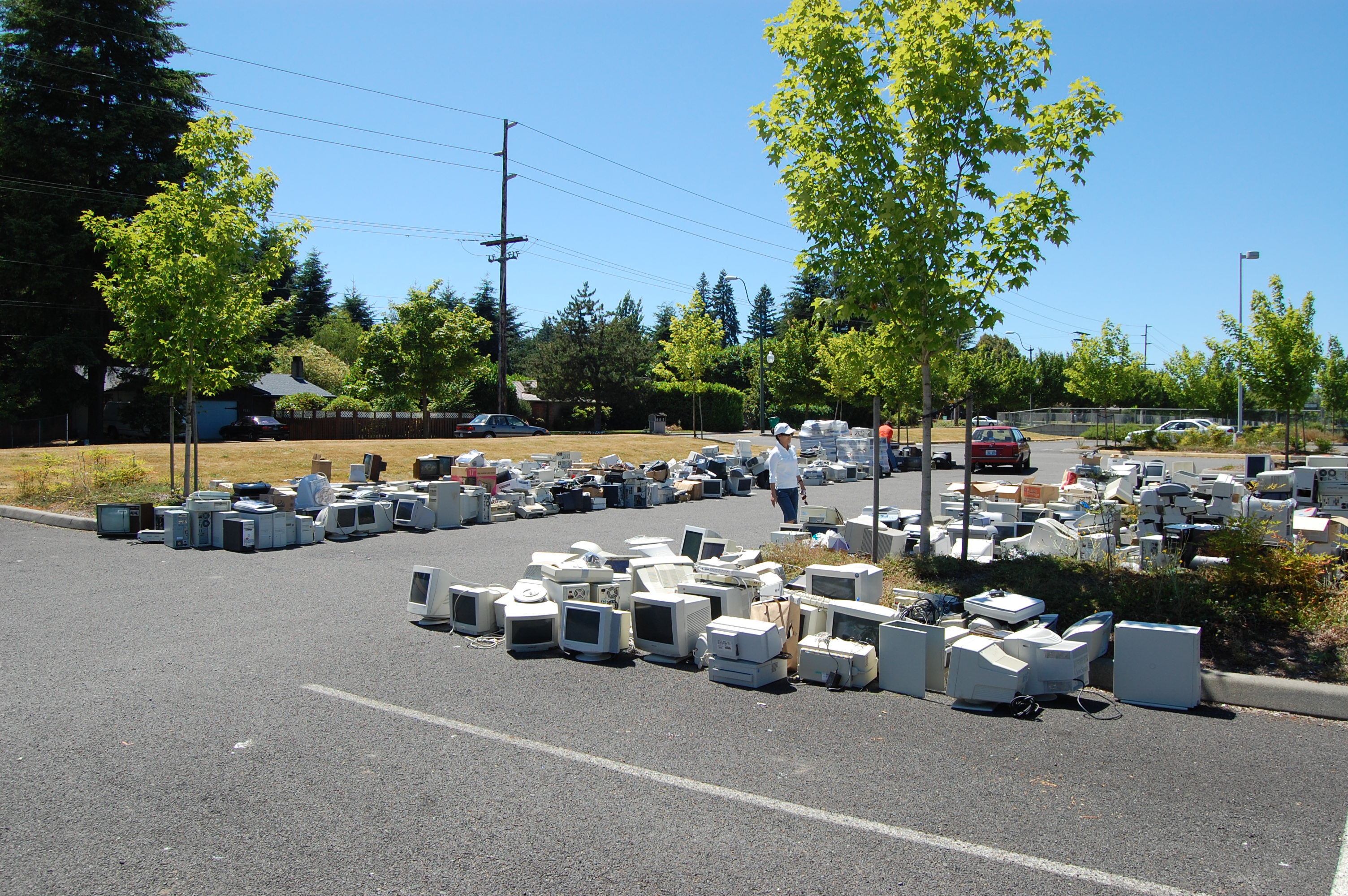 Used computers lined up for a recycling collection event